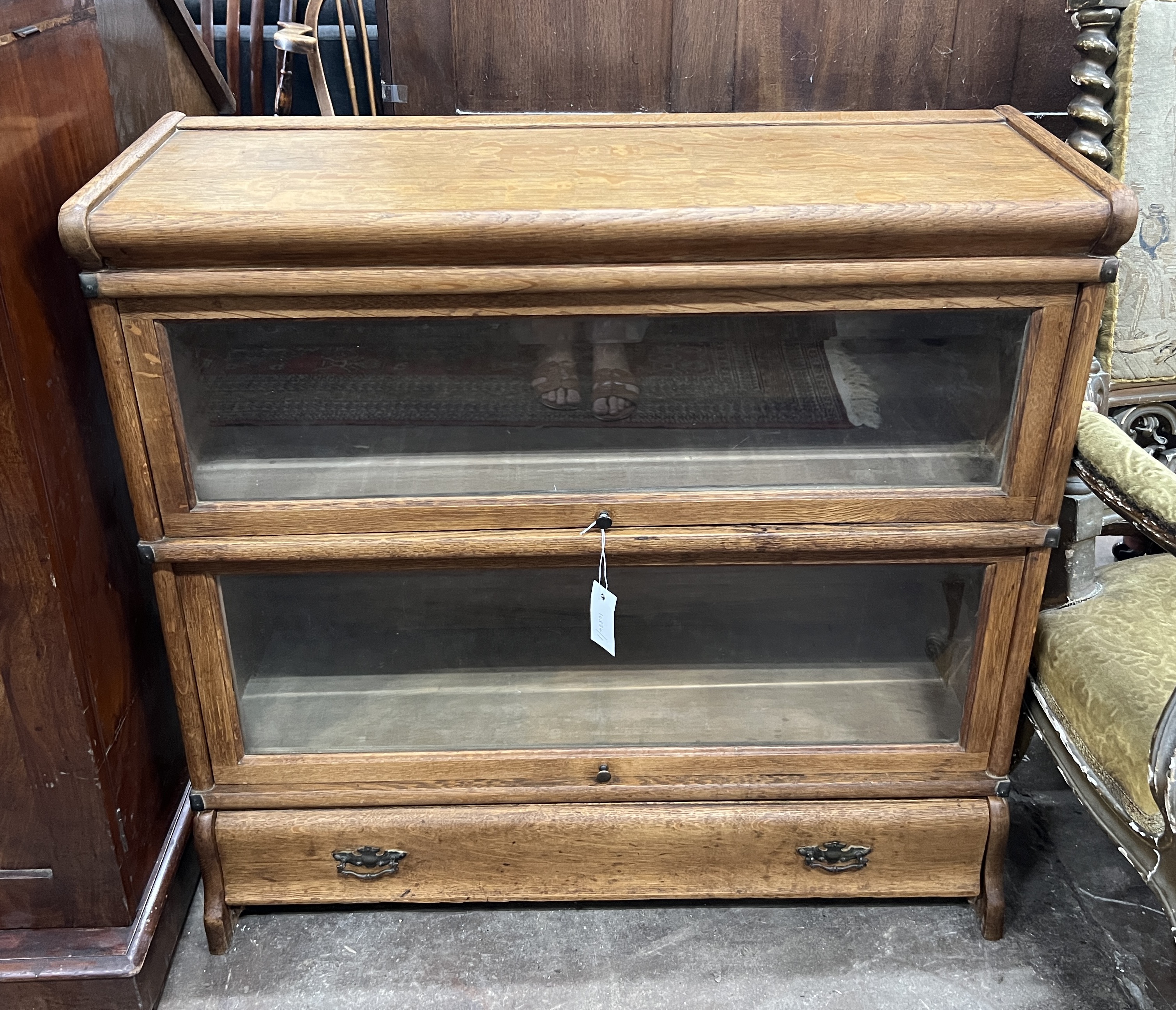 A Globe Wernicke oak two section bookcase with drawer, width 87cm, depth 30cm, height 84cm